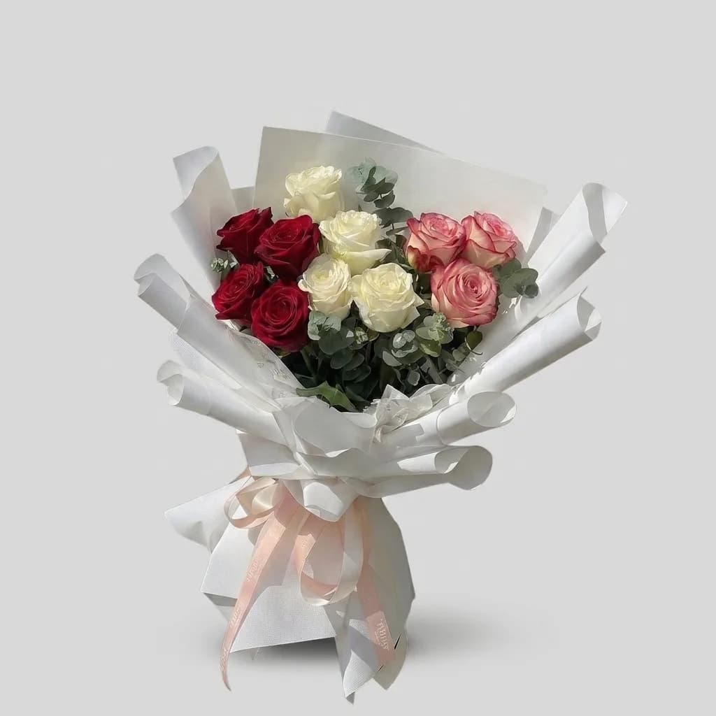 Elegant Combination of Red, White, and Peach Roses image