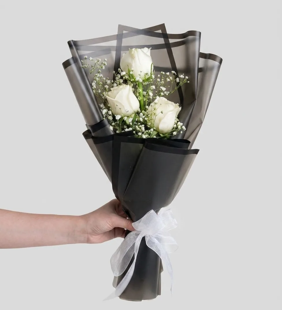 Three White Roses in Black Packaging image