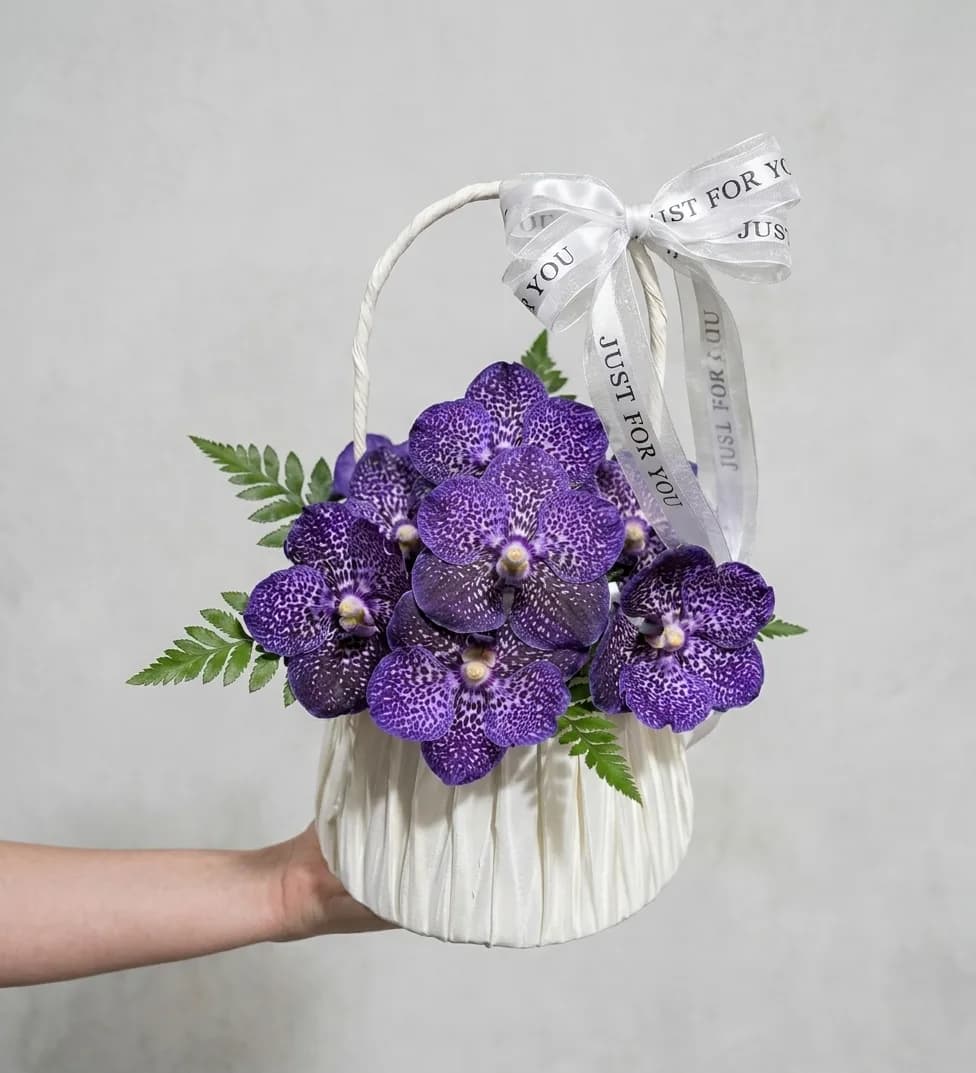 Colorful arrangement with purple orchids image