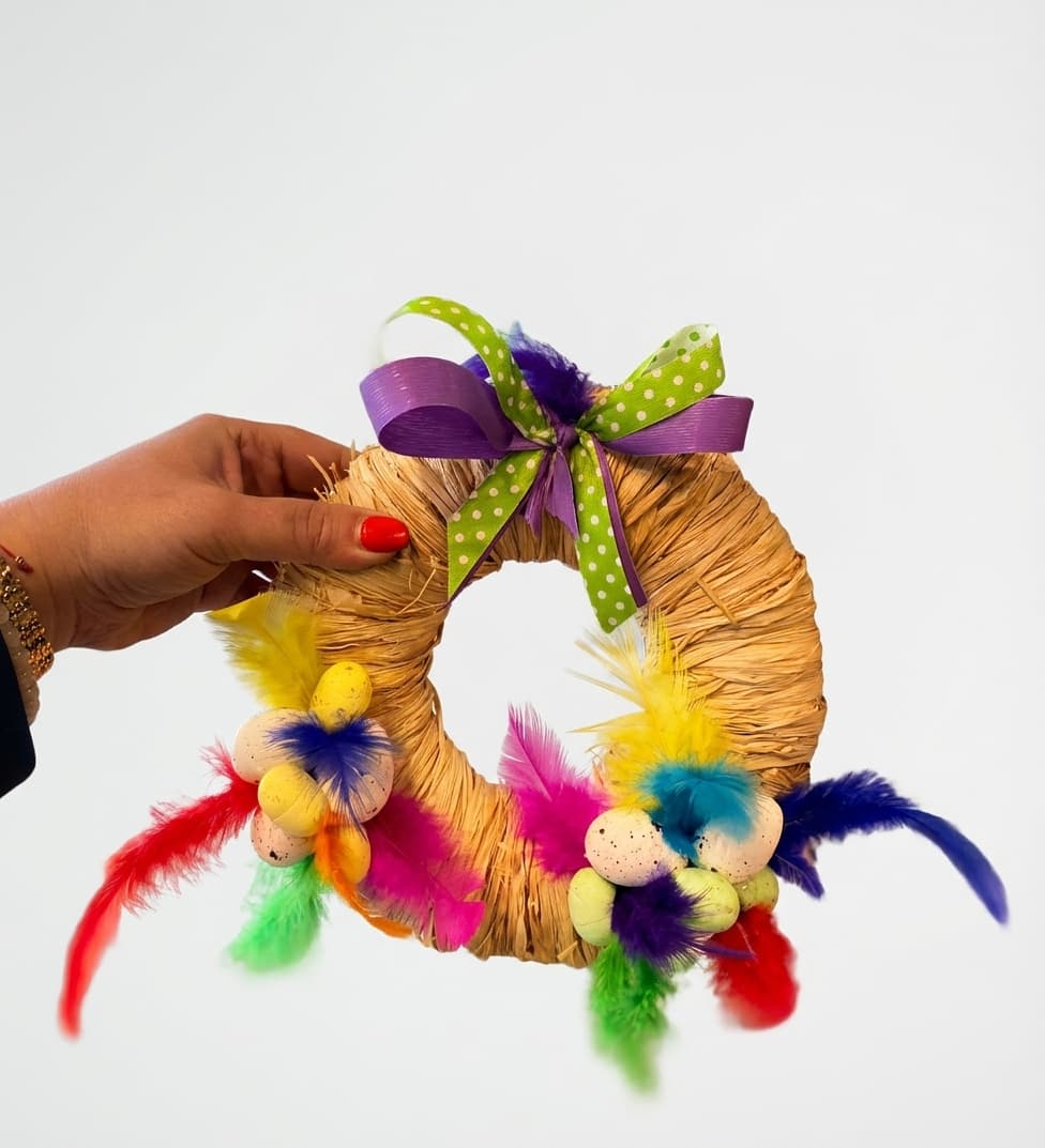 Decorative Easter Wreath with Feathers and Colorful Eggs image